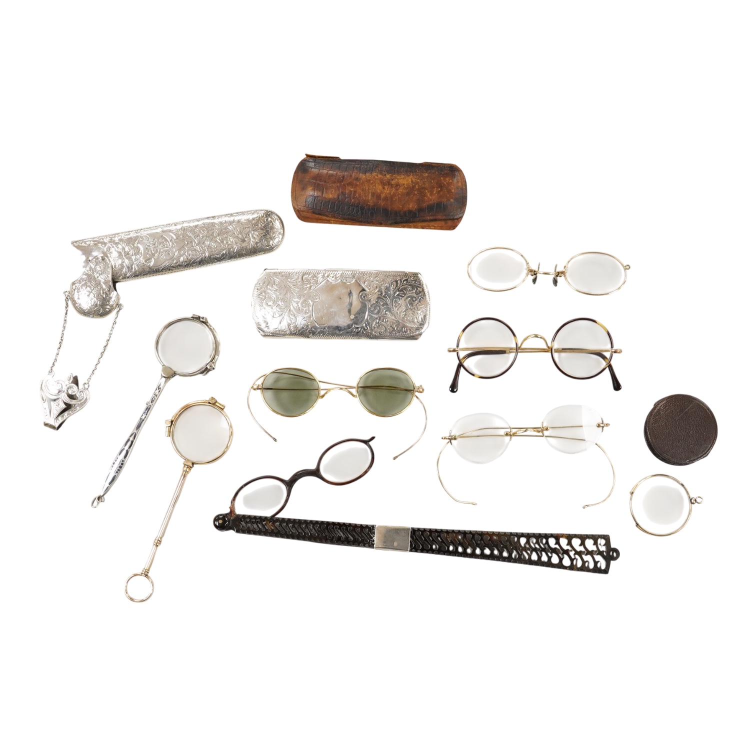 An Edwardian engraved silver spectacle case, by Boots Pure Drug Company, Chester, 1903, one other engraved silver spectacles case, hallmarks rubbed, a pair of 830 standard white metal and niello lorgnettes, two other pai